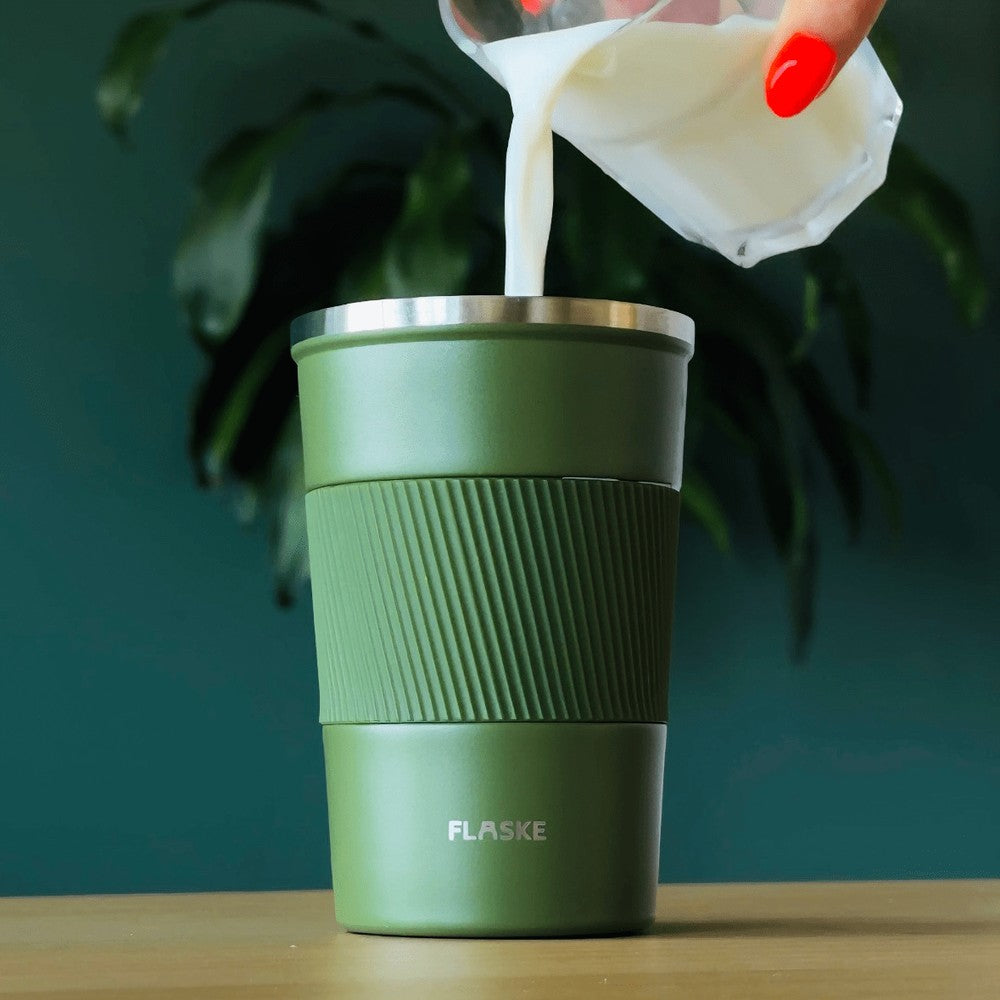 FLASKE Coffee Cup 380ml in Moss with milk being poured