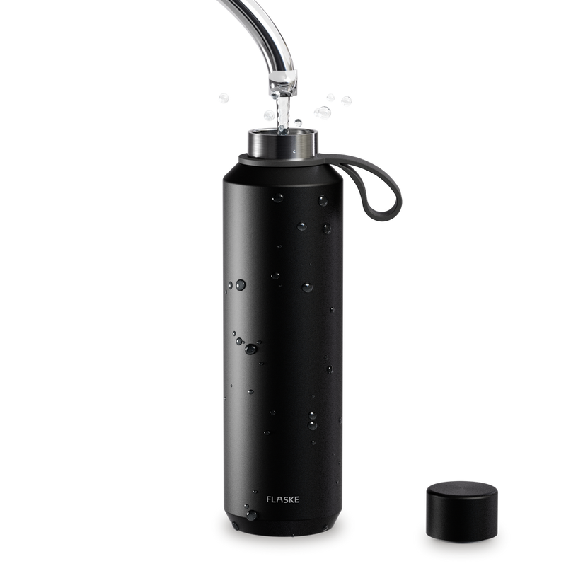 FLASKE EVO bottle rinsed under a tap